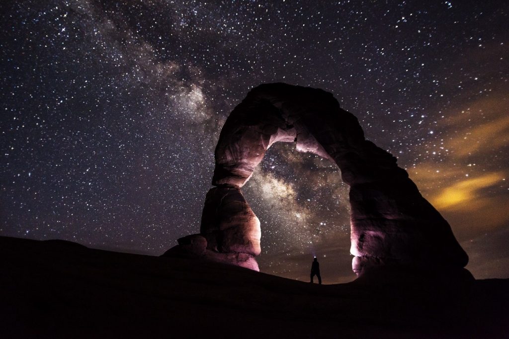 Stone arch against starry sky